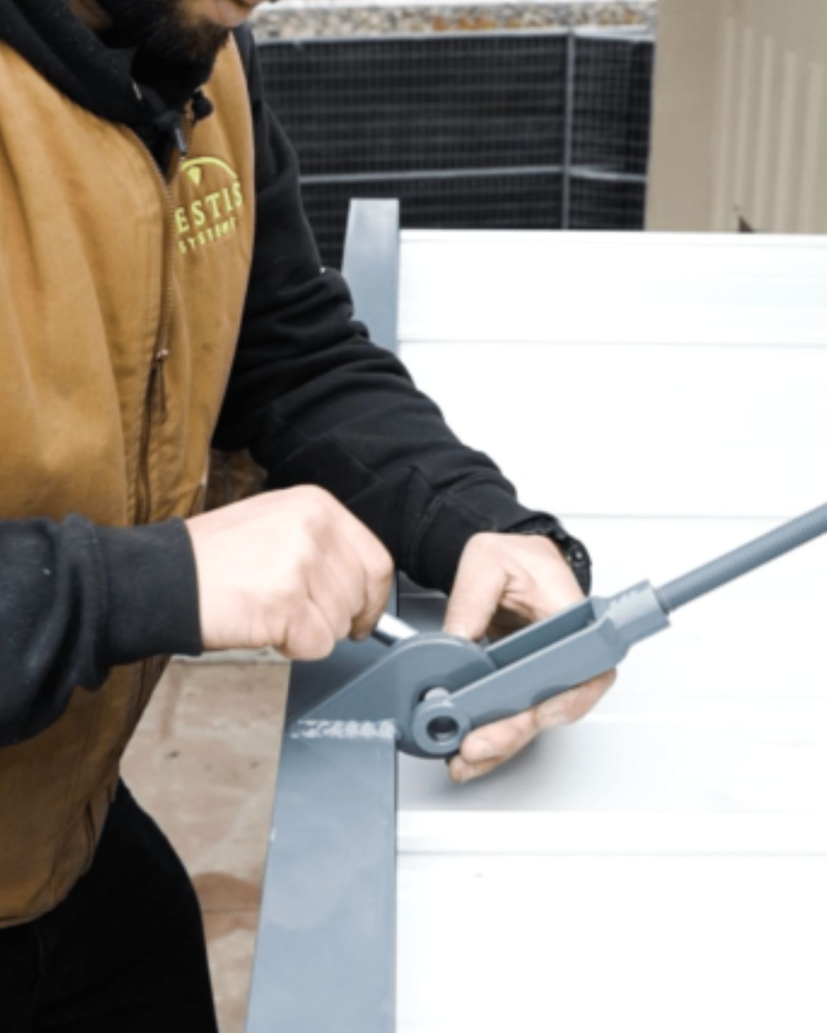 Vestis mfg employee working on a pre-designed canopy project