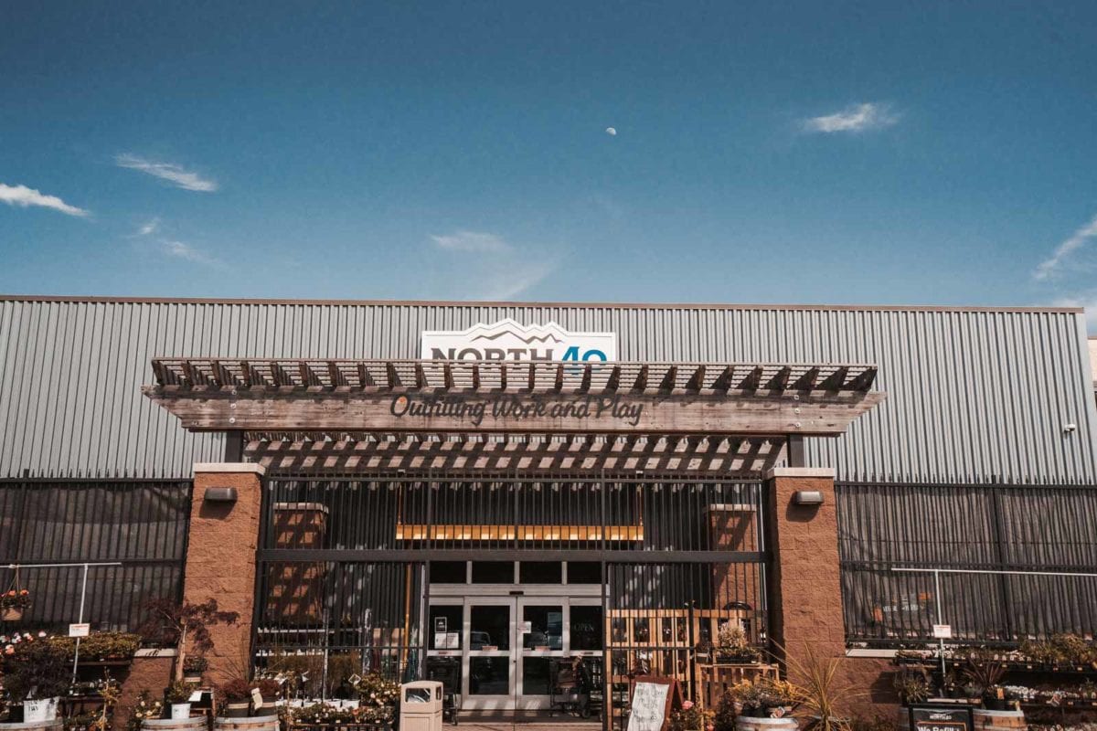 Commercial Architectural Projects | Vestis Projects The image shows Iron Horse Bar & Grill with a black aluminum awning from Vestis extending over the storefront, covering outdoor seating and the main entrance.