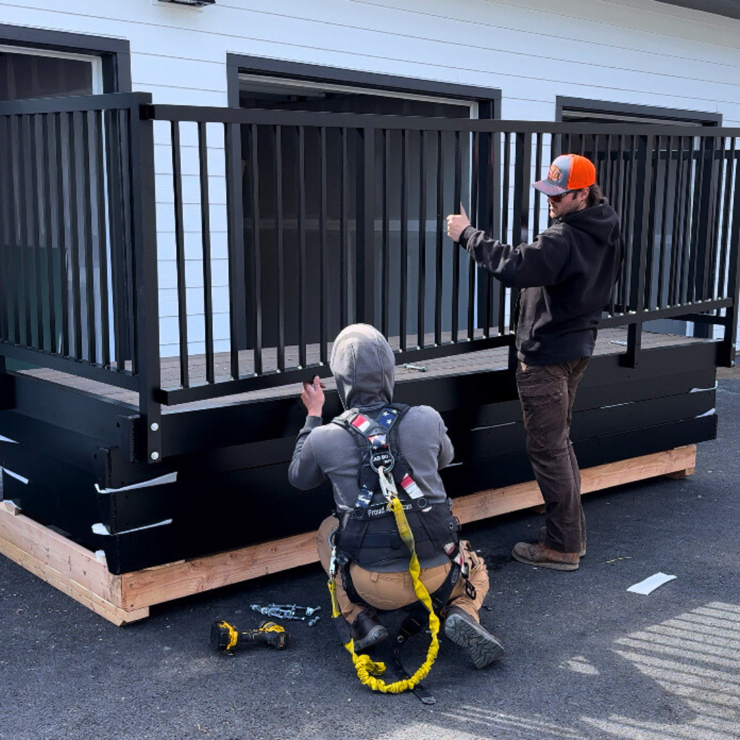 Vestis Aluminum Bolt-On Balcony Assembly Multiple Aluminum Bolt-On Balconies attached to a multifamily apartment building in a coastal area