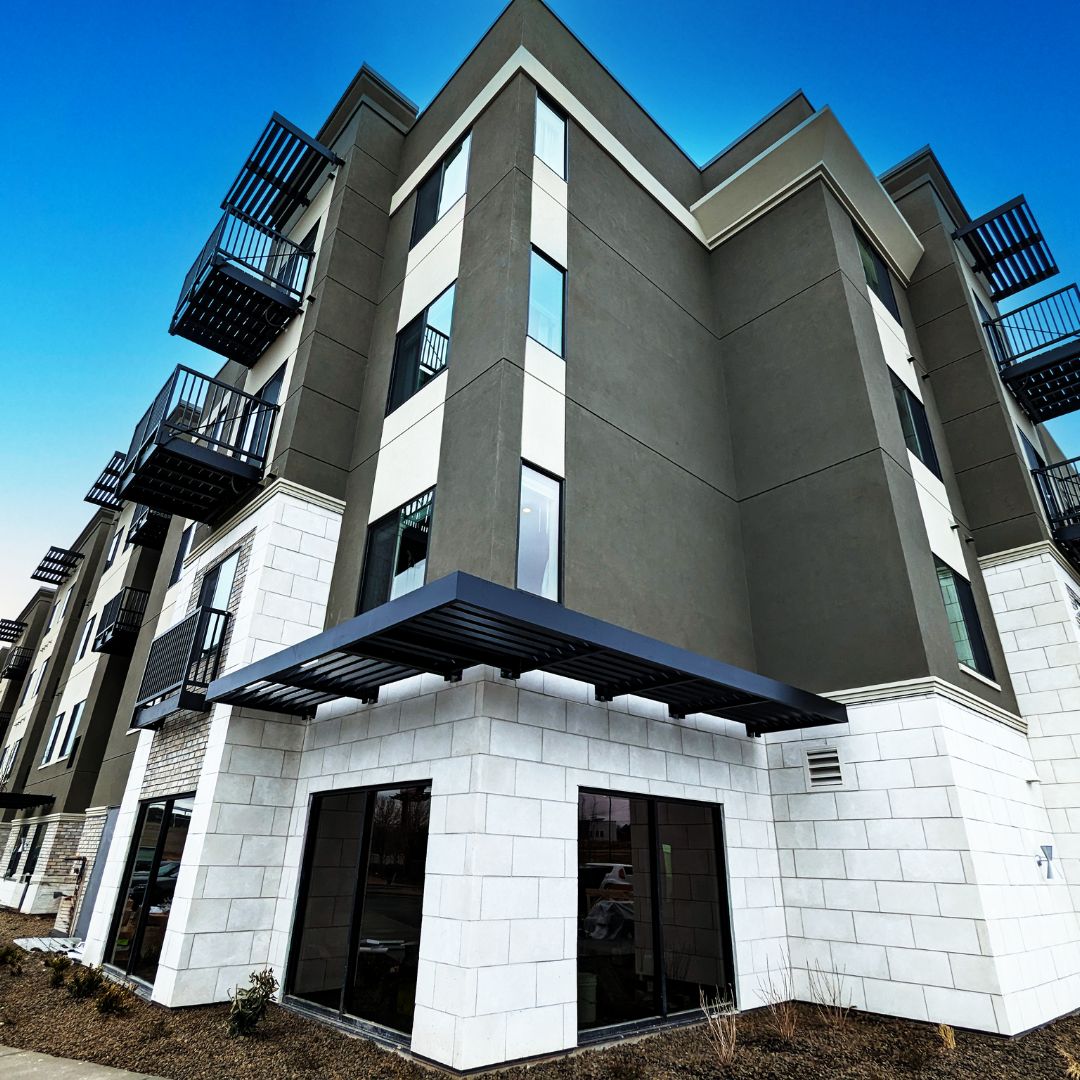 Vestis Manufacturing Bolt-On Balconies and Sunshades (1080 x 1080 px) (1) Multiple Aluminum Bolt-On Balconies attached to a multifamily apartment building in a coastal area