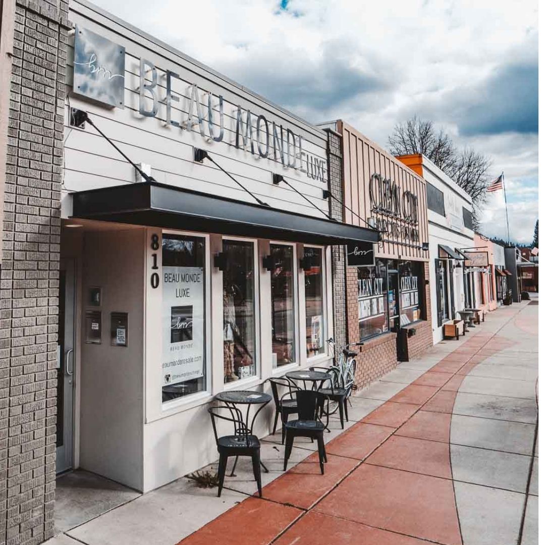 modern metal awning attached to a storefront retail store with outside seating available